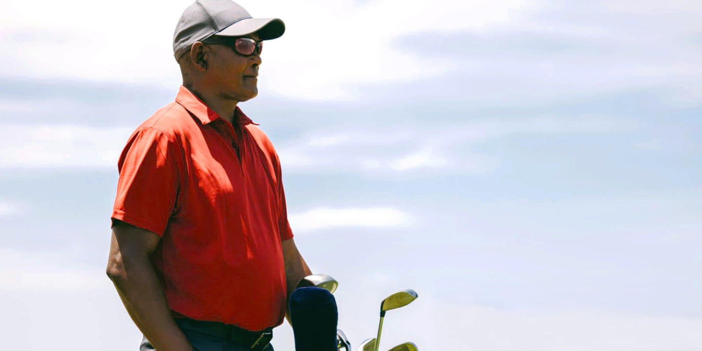 Golfer wearing PROGEAR Golf Prescription Sunglasses on the course, highlighting stylish sport wrap frame and UV protection in bright conditions.