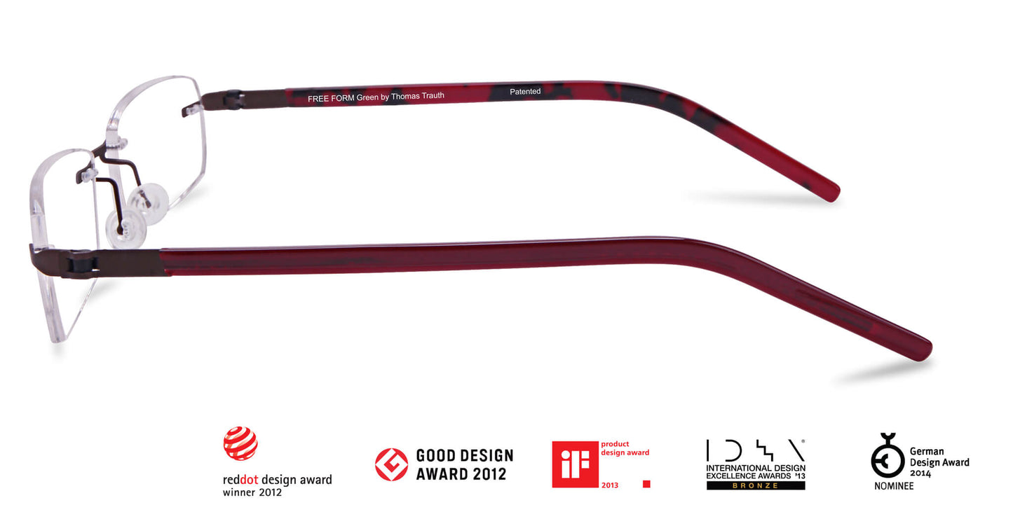 Free Form Eyewear™ Titanium 14g rimless eyeglasses in green with red temples, featuring luxury German design and screwless hinges for men and women.