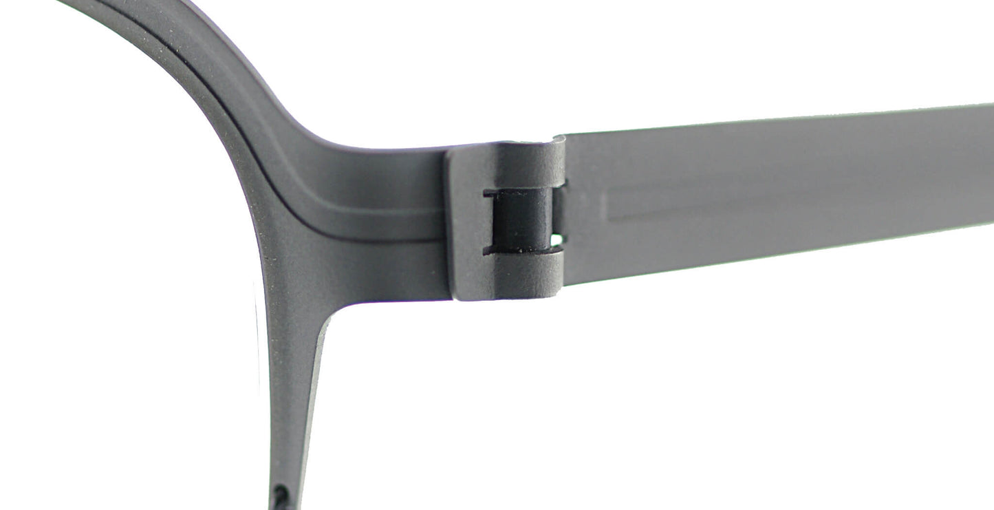 Close-up of Free Form Eyewear™ Titanium FFA934 screwless hinge in matte black, showcasing German-engineered lightweight 14g half-frame design.