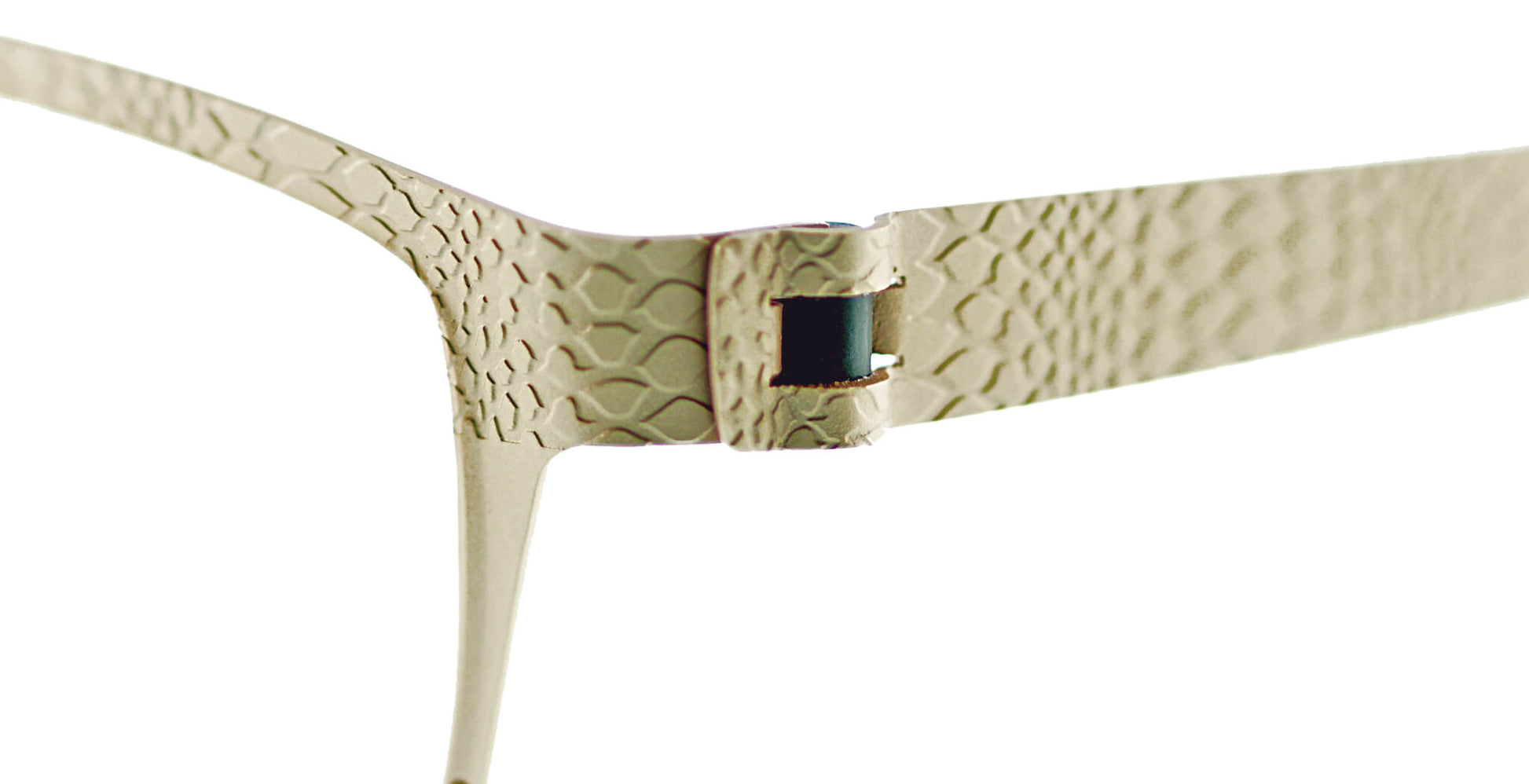 Close-up of Free Form Eyewear™ Titanium 14g feather-light eyeglasses hinge with textured snake-scale pattern in luxury German design. Screwless titanium frame ensures durability and comfort for men and women.