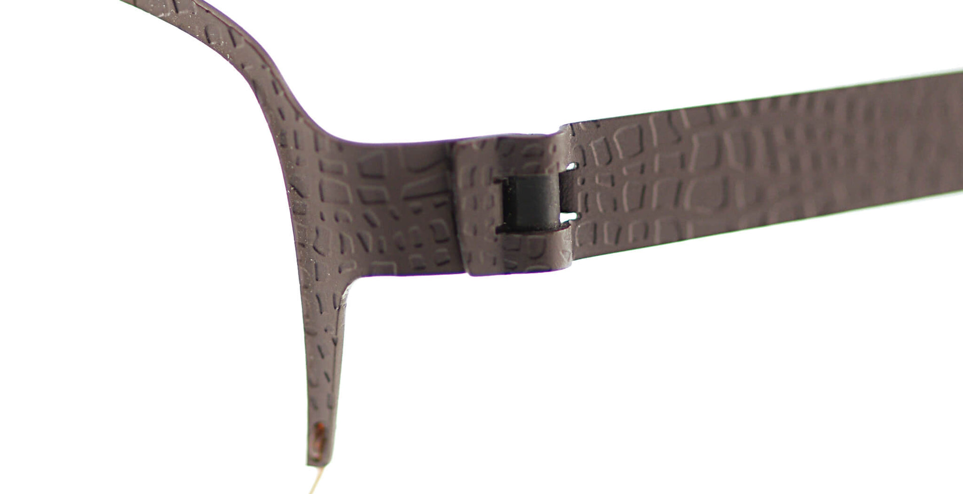 Close-up of Free Form Eyewear™ Titanium 14g feather-light eyeglasses, model FFA938, showing textured green half-frame with screwless hinge design.