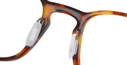 Close-up of Free Form Eyewear™ Titanium 14g feather-light eyeglasses in shiny tortoise, showcasing screwless hinge and soft nose pads for comfort.