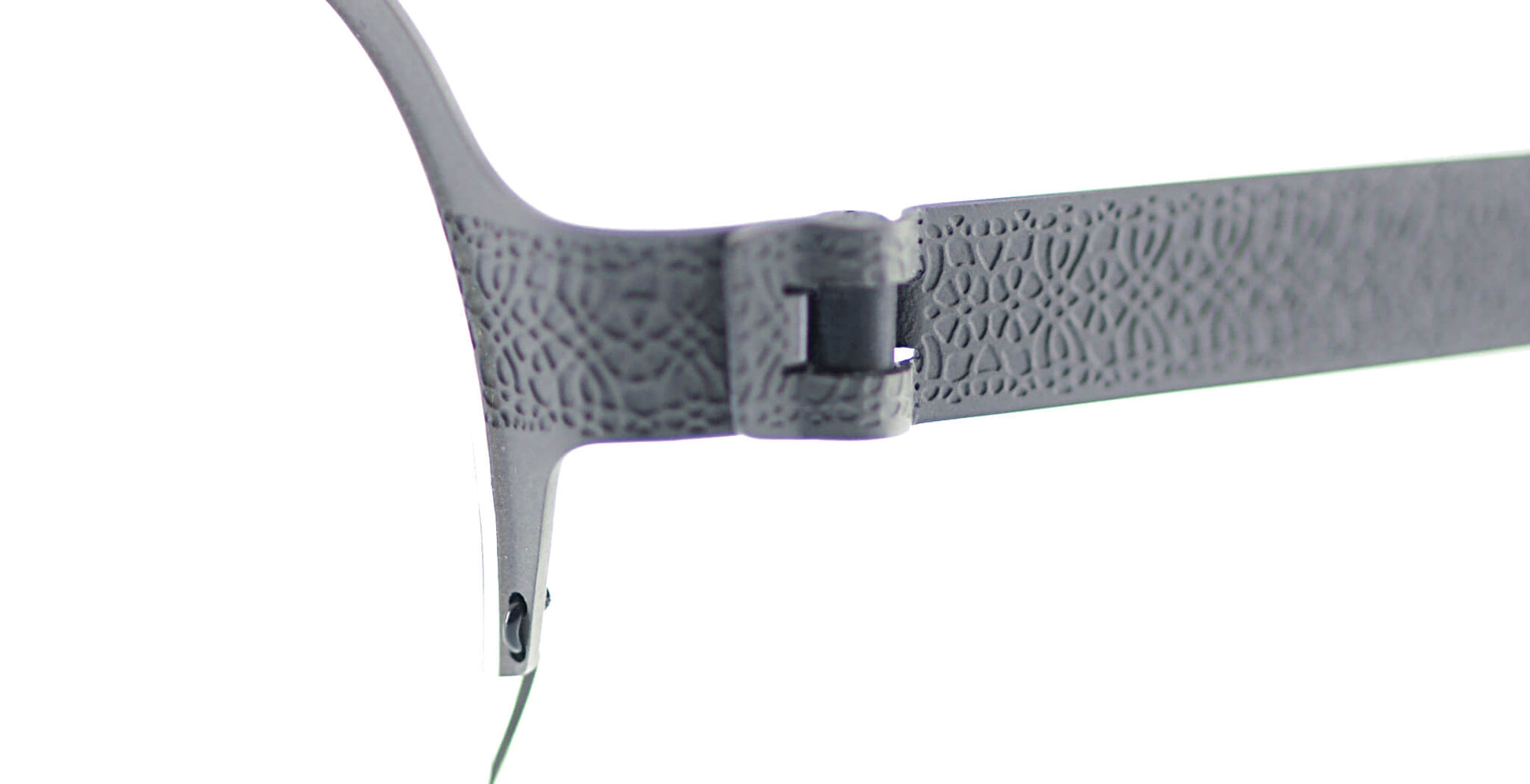 Close-up of Free Form Eyewear™ Titanium 14g feather-light eyeglasses, Model FFA937, showing screwless hinge and textured green half-frame design.