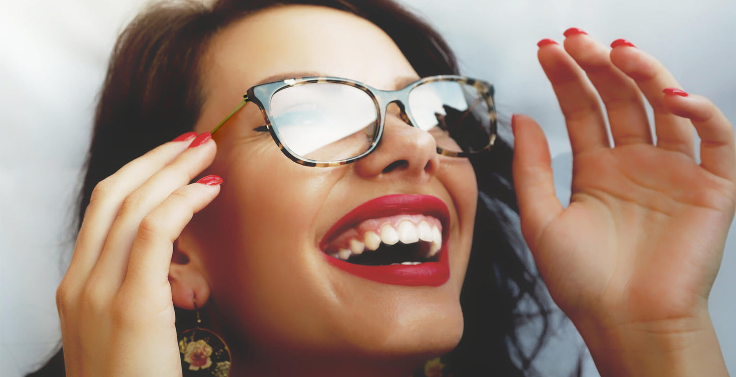 Woman wearing Free Form Eyewear™ Titanium 14g feather-light eyeglasses in green full frame. Luxury German design for men and women, lightweight and stylish.