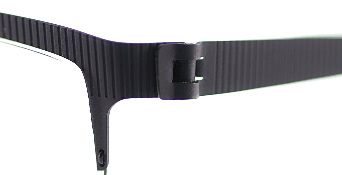 Close-up of Free Form Eyewear™ FFA932 titanium eyeglasses hinge showing screwless German-engineered design in lightweight black half-frame style.