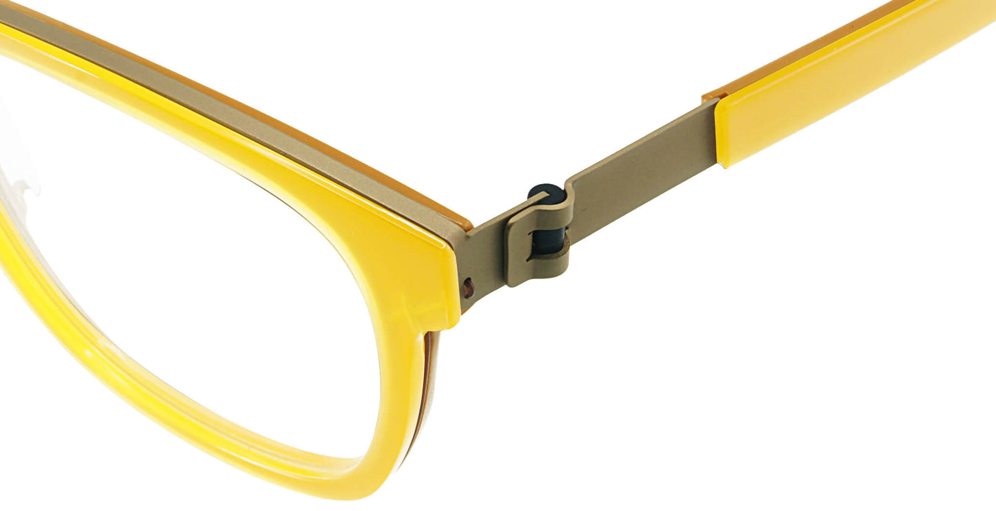 Close-up of Free Form Eyewear™ FFA983 yellow titanium eyeglasses showcasing screwless hinge and lightweight full frame design. Luxury German craftsmanship.