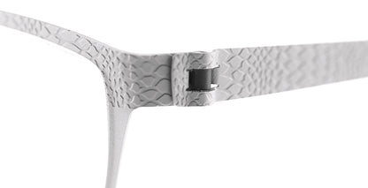 Close-up of Free Form Eyewear™ Titanium 14g feather-light eyeglasses hinge in textured silver finish. Features screwless German design for durability.