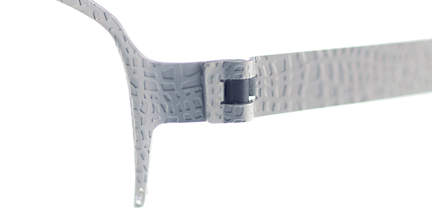 Close-up of Free Form Eyewear™ Titanium 14g feather-light eyeglasses hinge in crocodile-textured silver finish. Screwless German design for durability.