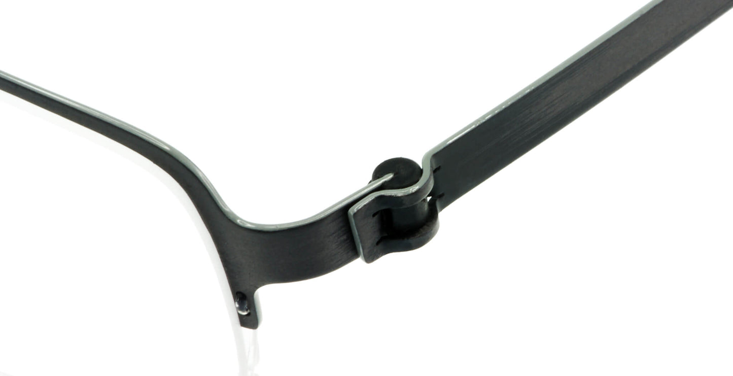 Close-up of Free Form Eyewear™ FFA904 green titanium half-frame glasses showcasing screwless hinge design. Lightweight 14g luxury German engineering.